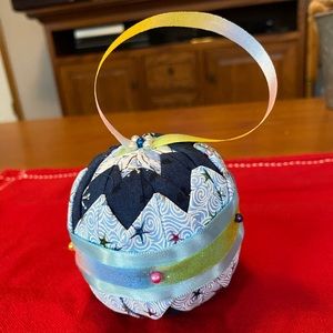 Hand made no sew quilt, ornament, blue, and multicolor sparkle. Beautiful.